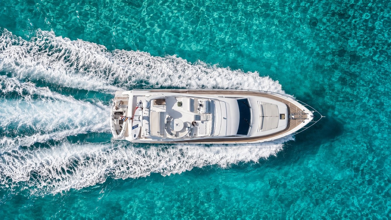 Yacht cruising over turquoise water